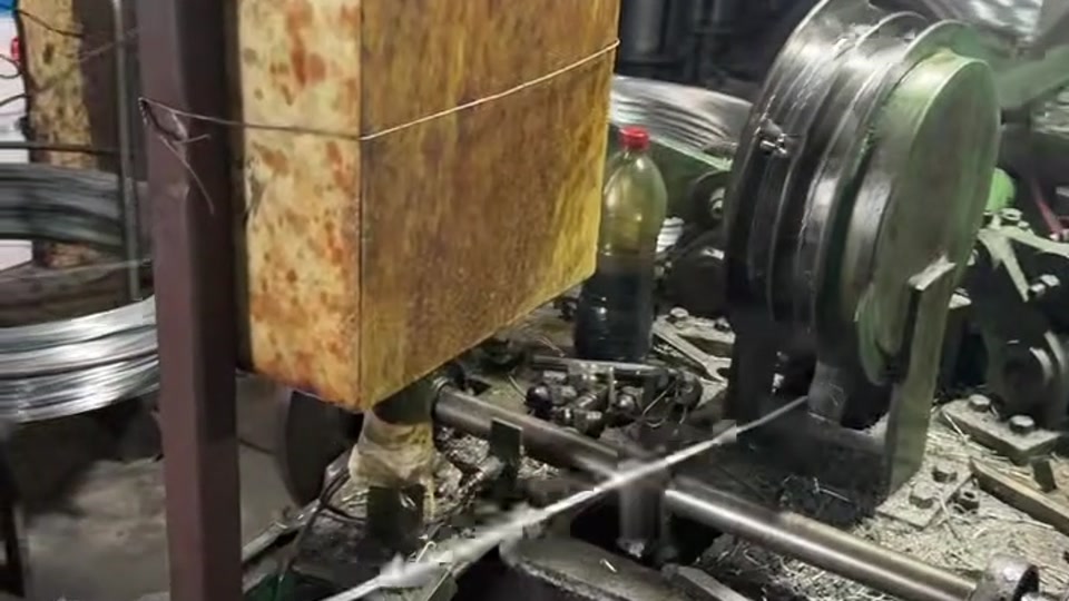 Galvanized barbed wire manufacturing machine operating in the KUNYU FENCING workshop