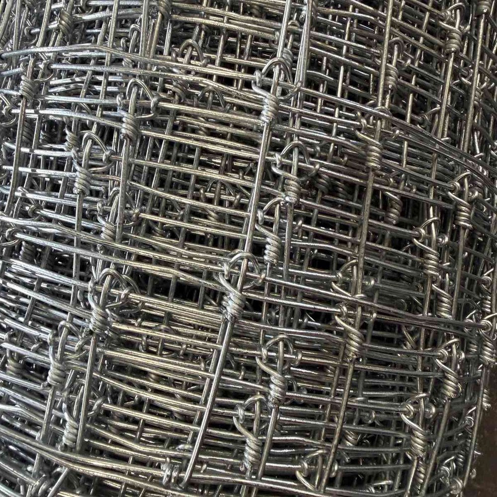 Close-up of galvanized fixed knot fence rolls