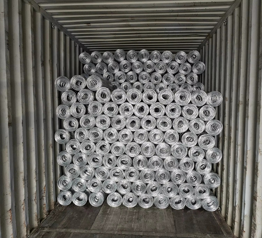 Hinge joint field fence rolls loaded in an export container