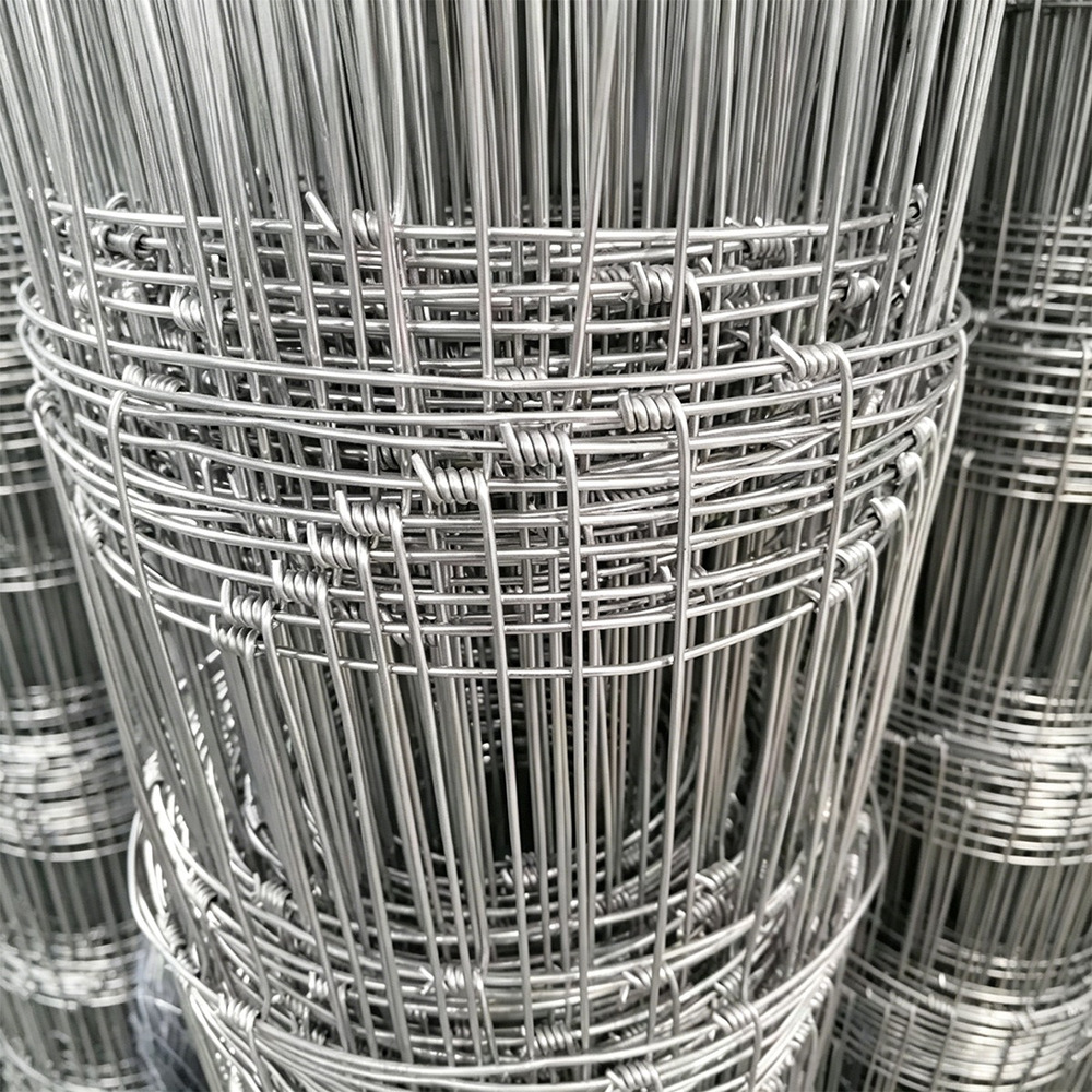 Close-up of galvanized hinge joint livestock fence roll construction