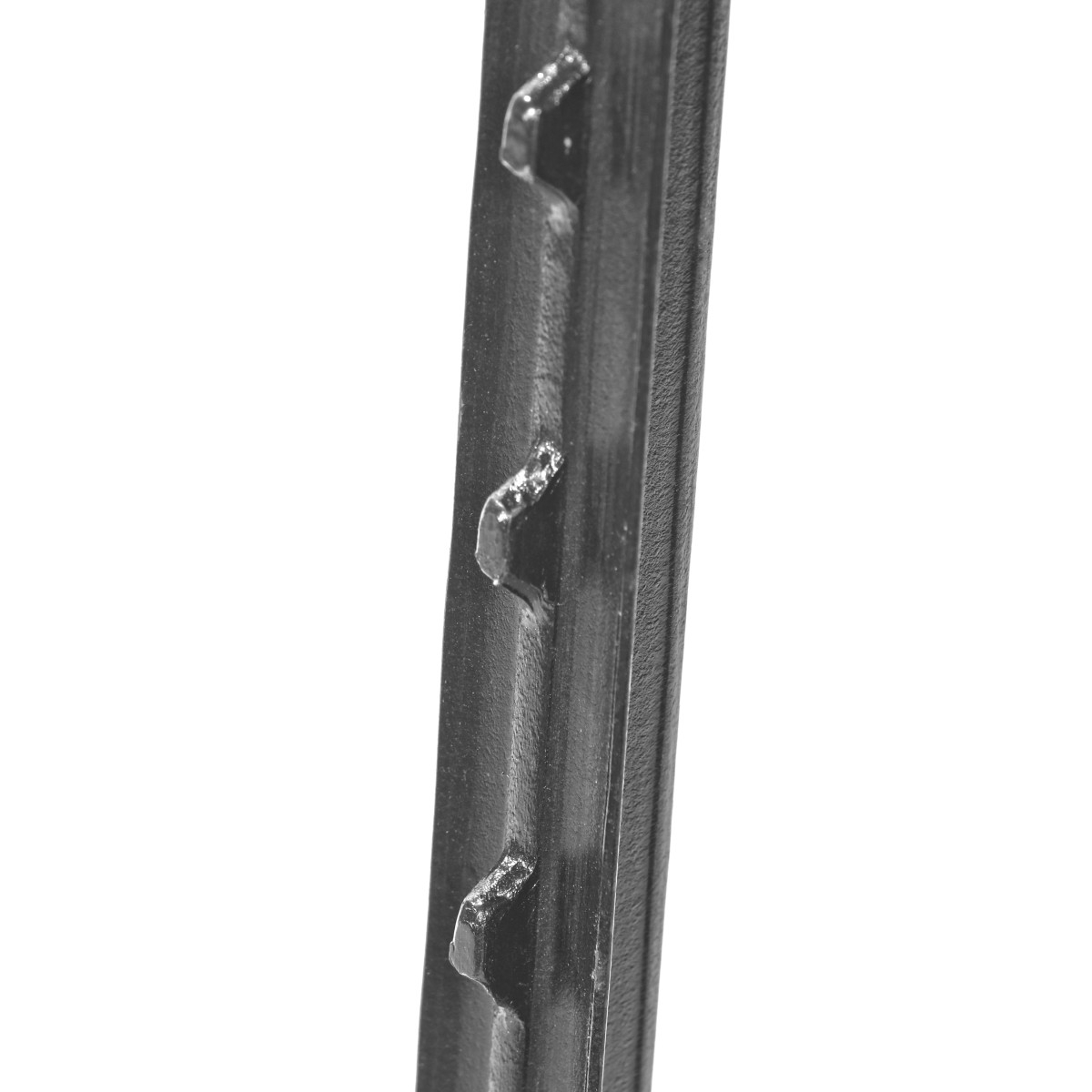 Close-up of steel T-post studs that hold field fence wire at the correct spacing